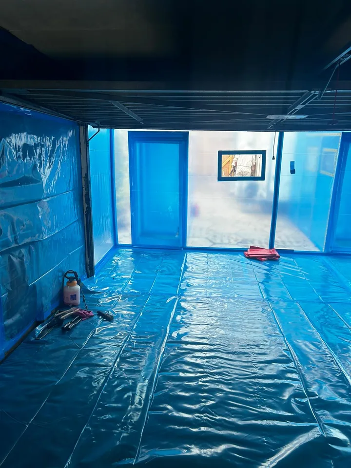 Interior of an enclosure with protected floor and doorway