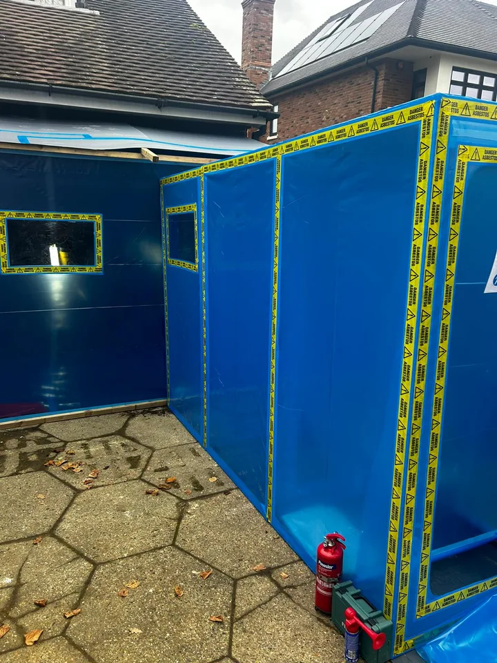 Temporary external enclosure with blue sheeting