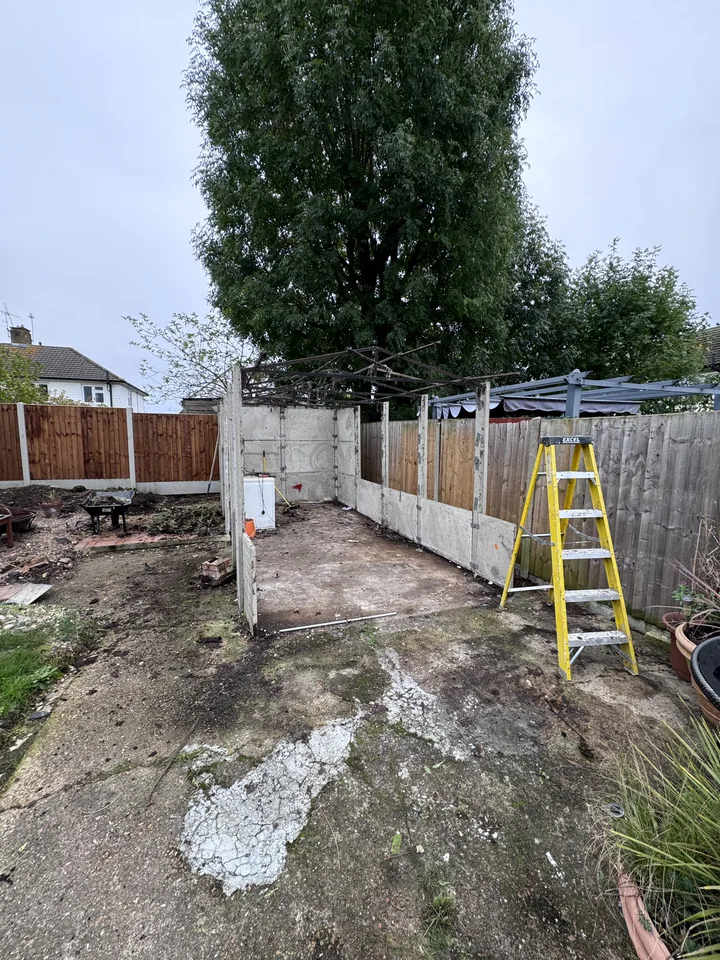 Partially dismantled garage during removal