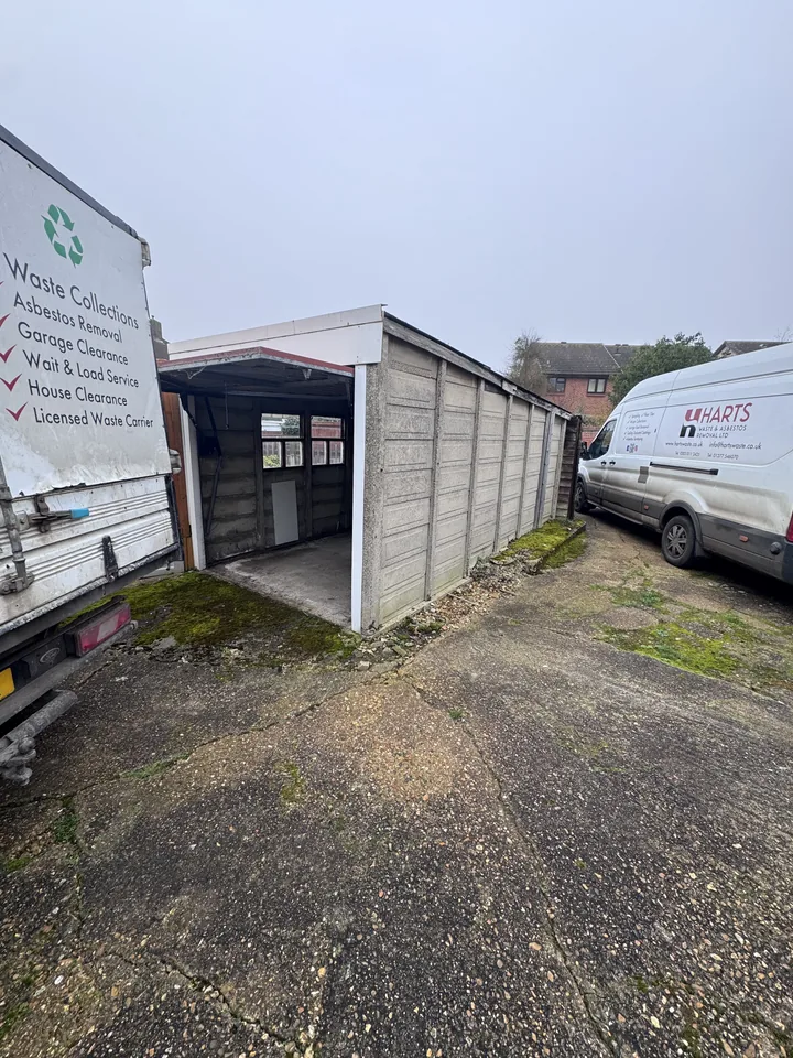 Garage before removal with a Harts Waste vehicle alongside
