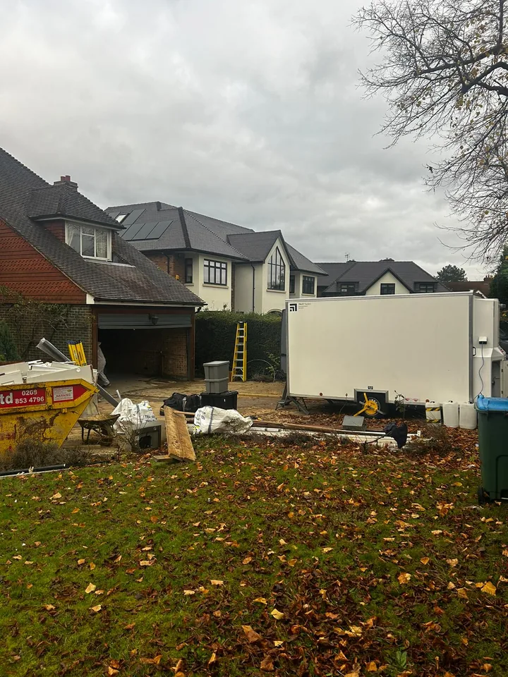 Cleared garden with an exposed outbuilding base