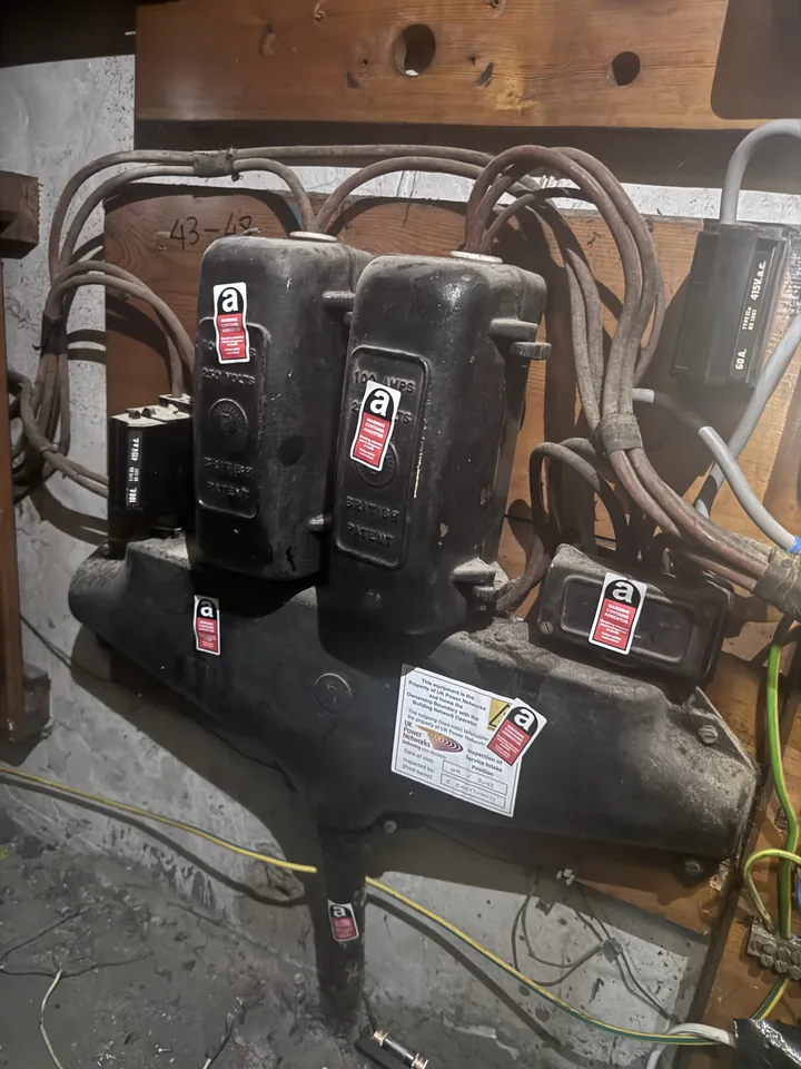 Older electrical equipment with asbestos warning labels