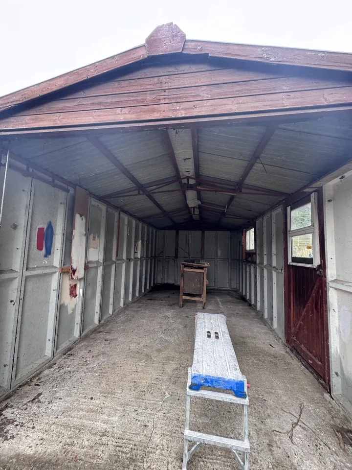 Garage interior with corrugated roof in place