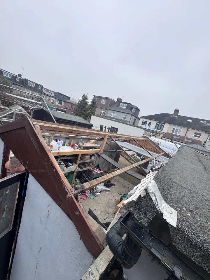 Exposed timber roof framing after sheet removal