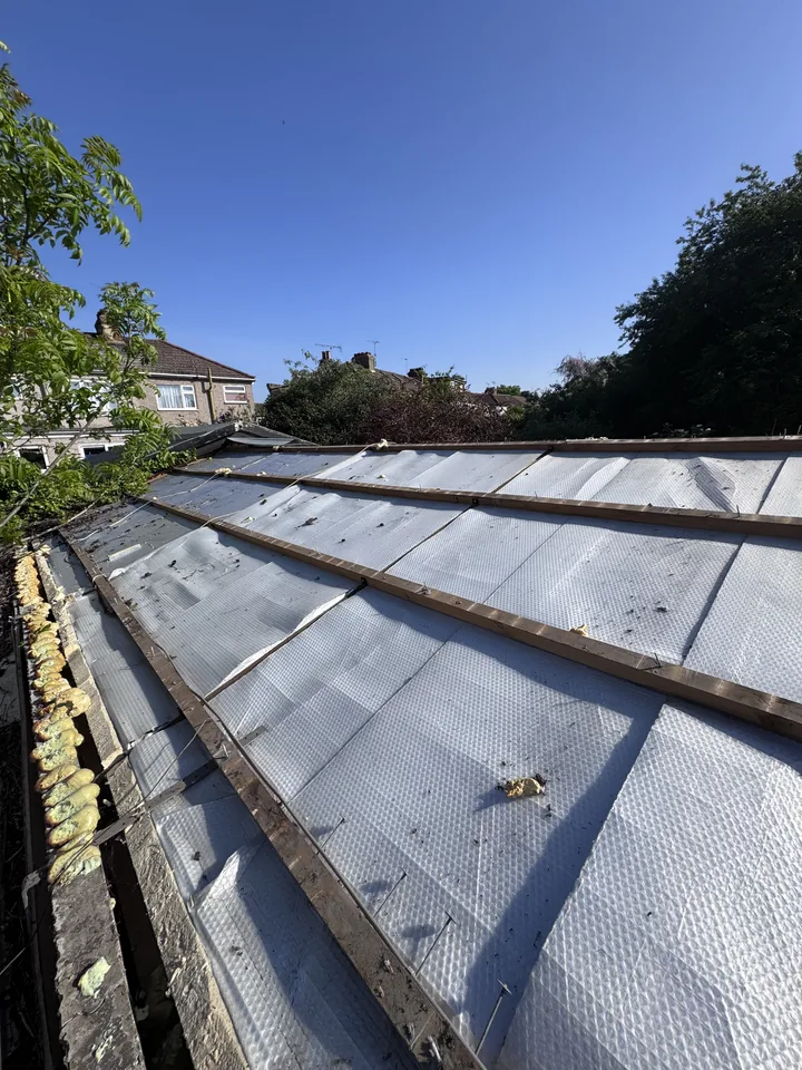 Garage roof with framework exposed after the sheets were removed