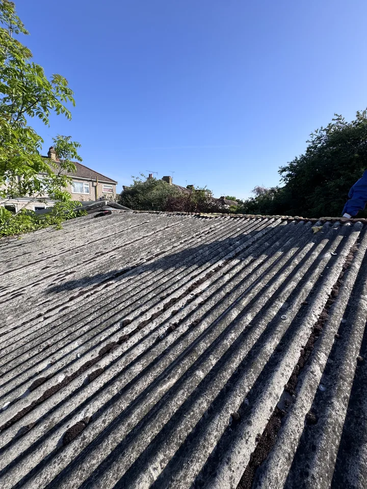 Old corrugated garage roof before sheet removal