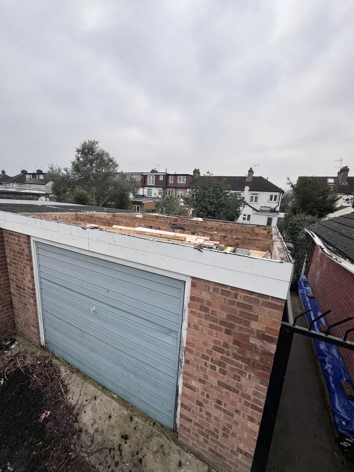 Garage roof with framework exposed after sheet removal