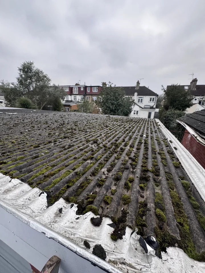Old corrugated garage roof before sheet removal