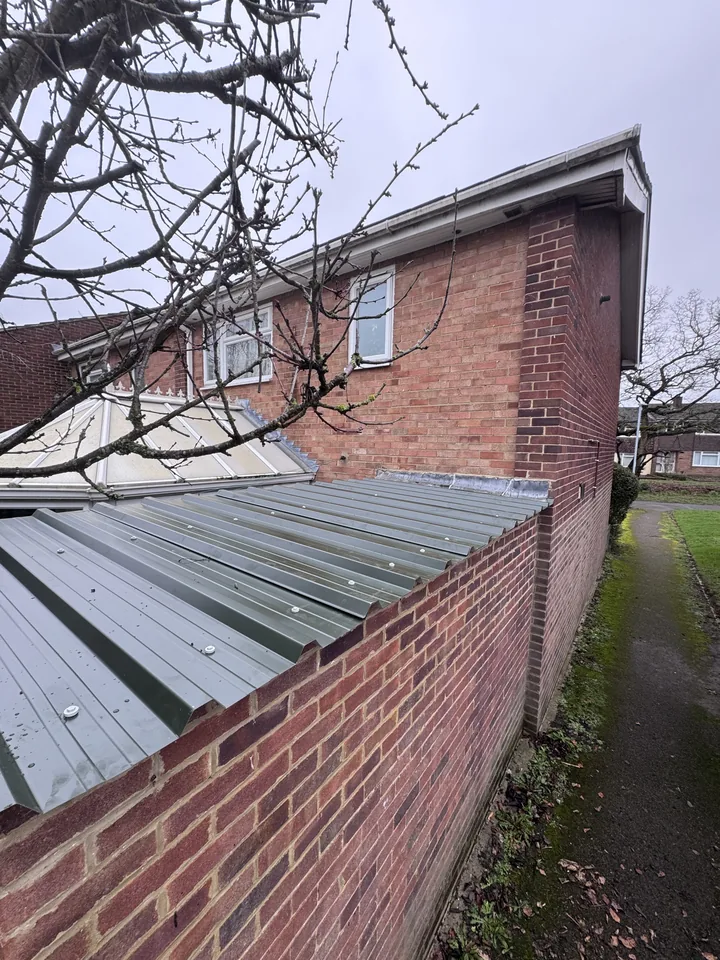 Lean-to with a new metal roof fitted