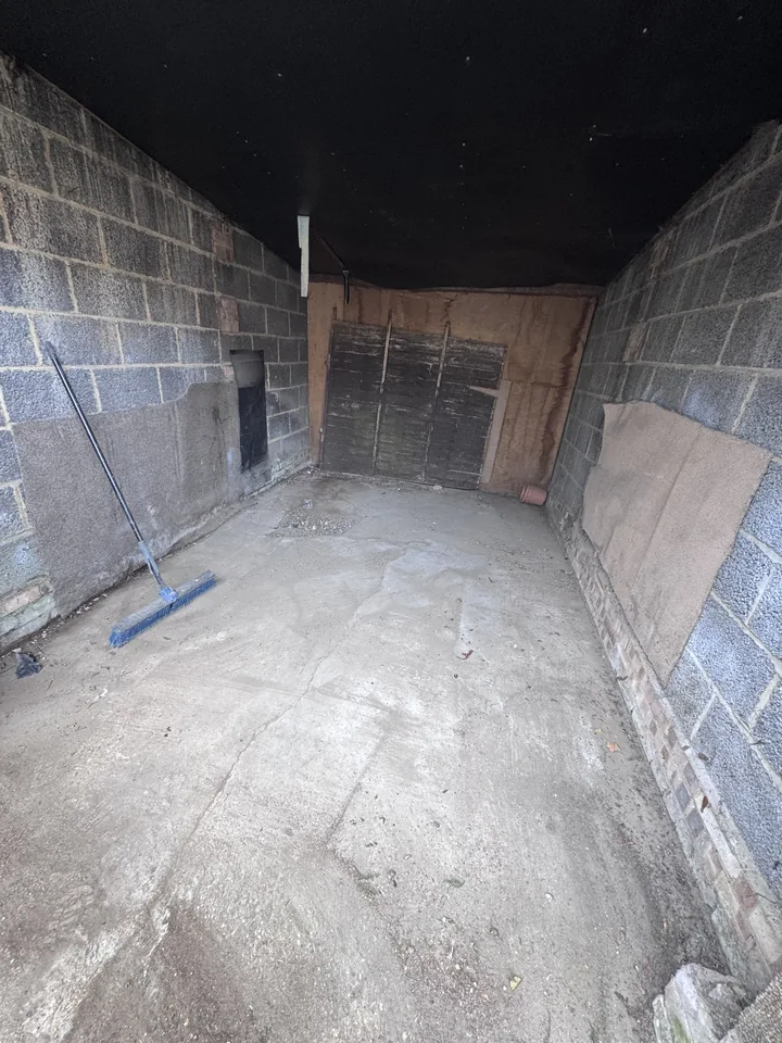 Cleared floor inside the outbuilding